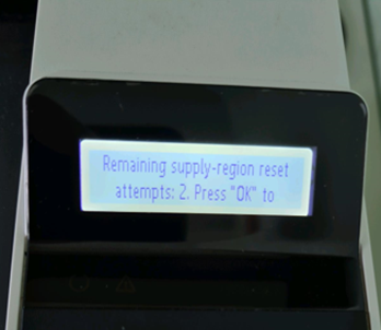 Confirmation message to reset the printer supply region on 2-line LCD display