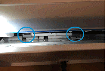 An example of paper pick rollers on top loading printer