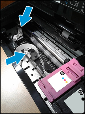 Example of a printer with paper debris in the carriage path