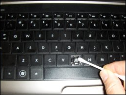 Cleaning the key and its slot in the keyboard